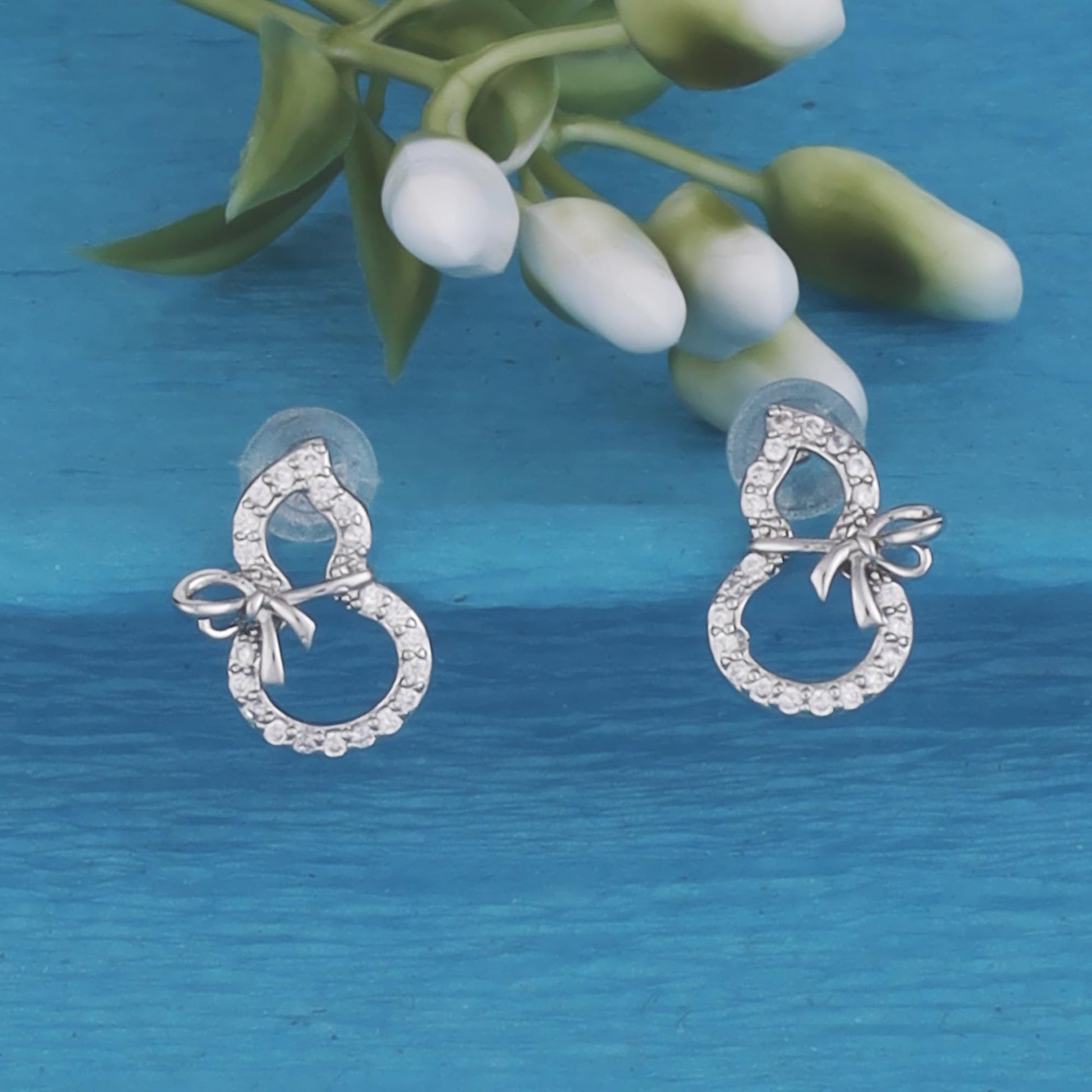 Saloni Fashion Jewellery Stylish Figure 8 Shape Studded CZ Silver Plated Stud Earring For Women