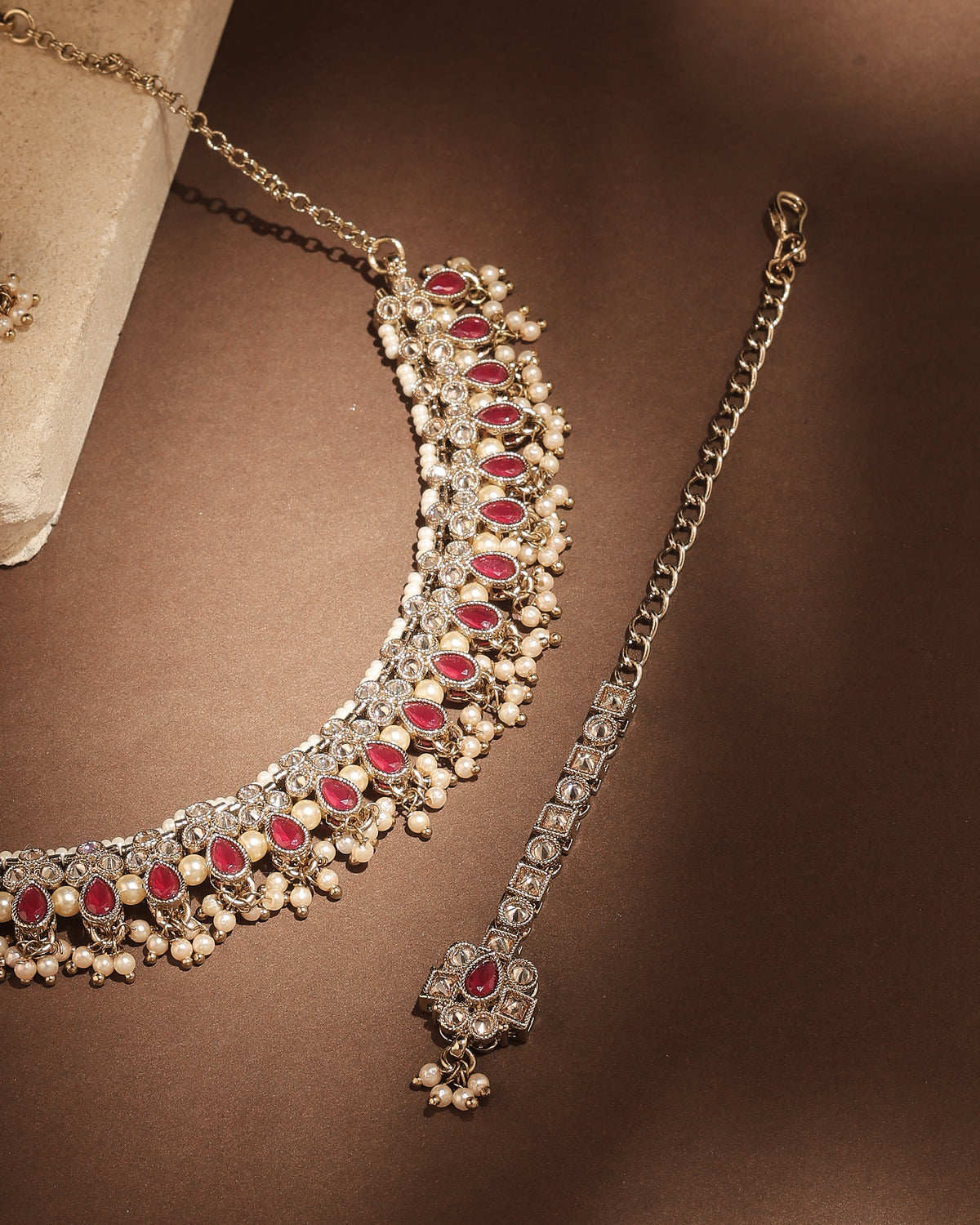 Pear Shape Pearl Guchha Antique Gold Plated Red Uncut Kundan Stone - styled view | Saloni Fashion Jewellery, Mumbai