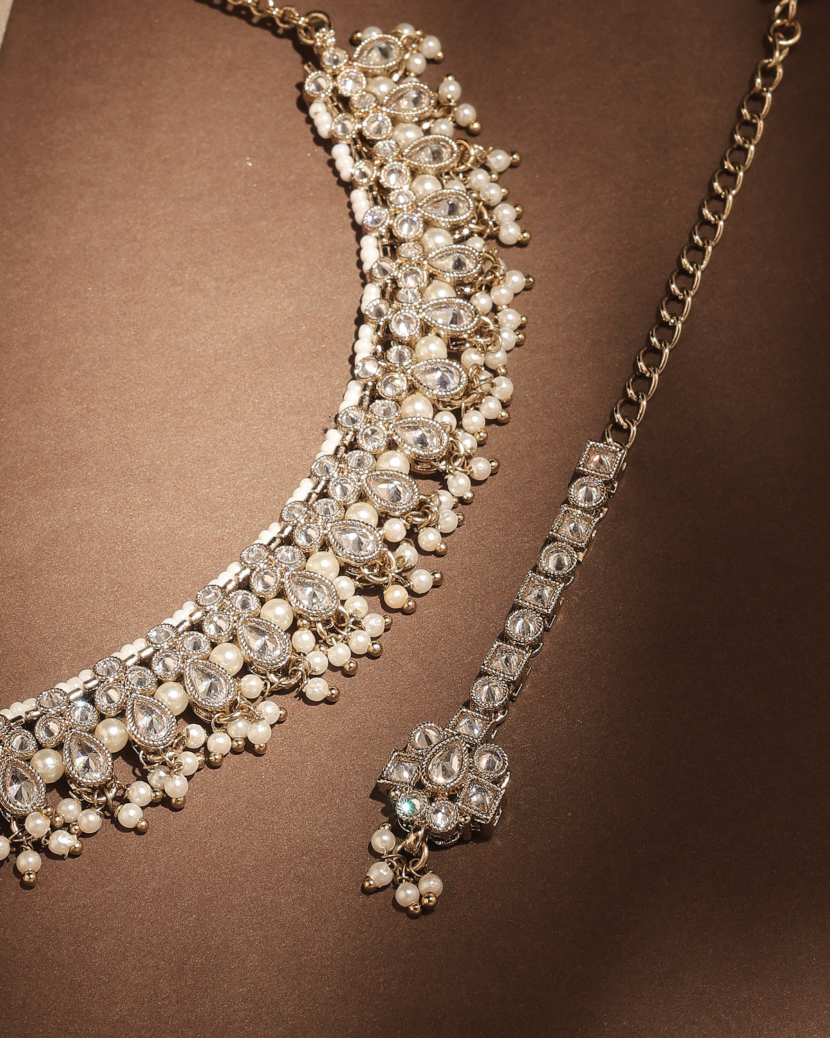 Pear Shape Pearl Guchha Antique Gold Plated White Uncut Kundan - styled view | Saloni Fashion Jewellery, Mumbai