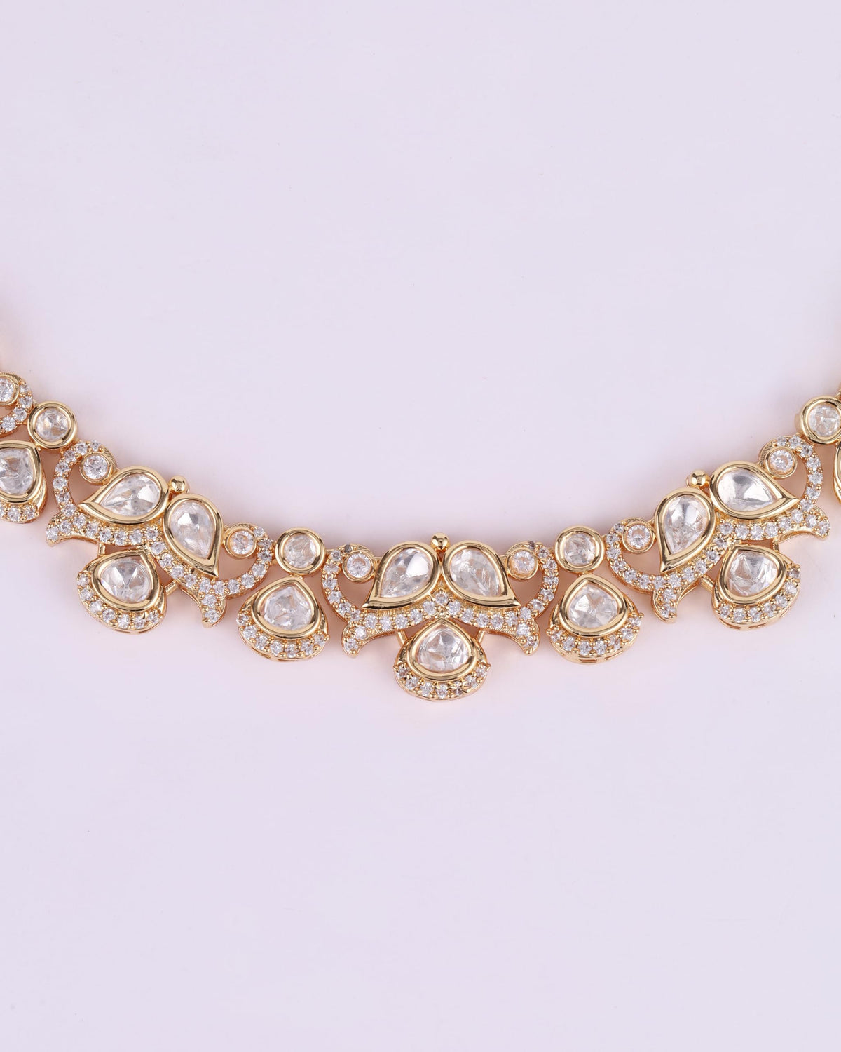 Saloni Fashion Jewellery Round and Paisley Shape CZ Studded Uncut Kundan Stone Rose Gold Plated Brass Choker Necklace Set with Maang Tikka For Women and Girls
